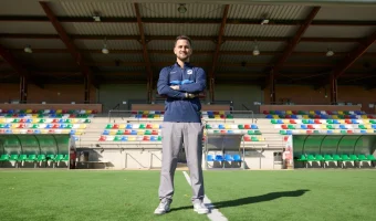 Siello team member standing on a football pitch in Madrid within the academy’s sporting and competitive environment.